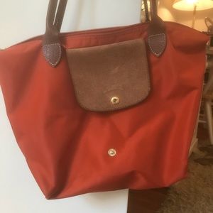 Orange longchamp purse